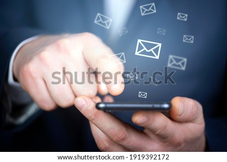 Businessman hand sending e-mails. Business economic technology working connect concept. 