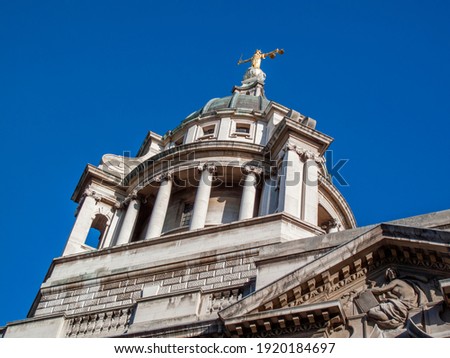 Scales of Justice of the Central Criminal Court fondly known as the Old Bailey London England, UK which dates from 1902 and is a popular travel destination tourist attraction landmark of the city