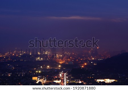 Factory area surrounded by night fog