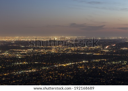 Mountaintop view of Pasadena and Los Angeles at dusk.