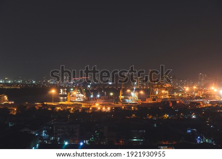 Aerial panoramic cityscape view of Ho Chi Minh city and the River Saigon, Vietnam with beautiful lights at night. Financial and business centers in developed Vietnam. Saigon skyline.