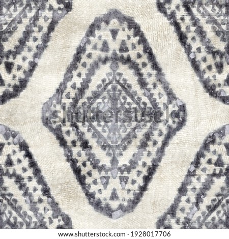 Seamless grungy tribal ethnic rug motif pattern. High quality illustration. Distressed old looking native style design in shades of gray and cream. Old artisan textile seamless pattern.