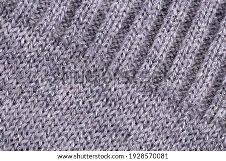 Knitted garment texture as background or backdrop.