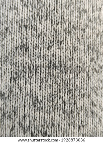 black and white dot clothes.Closeup texture of natural weave cloth in gray or black color. Fabric texture of natural cotton or linen textile material. Thailand