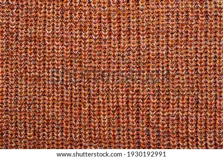 Texture of a sweater made of mixed composition yarn. 