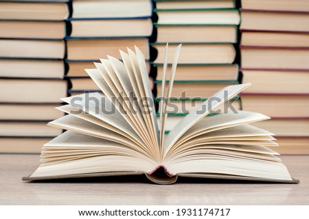 Open book, hard books on a wooden table. Education. 