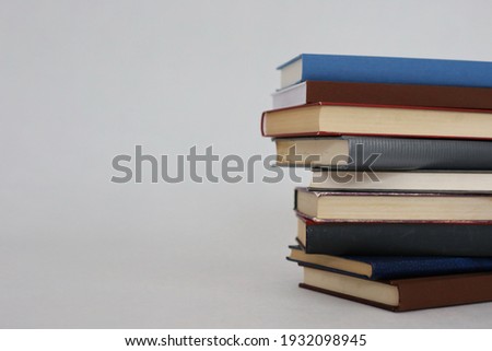 _Stack of books on white background
