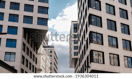 Abstract angled office building windows background. architectural complex of residential buildings
