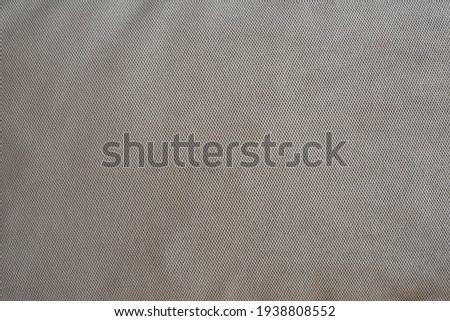 The texture of the upholstery fabric is gray-blue. Corduroy texture. Velvet.