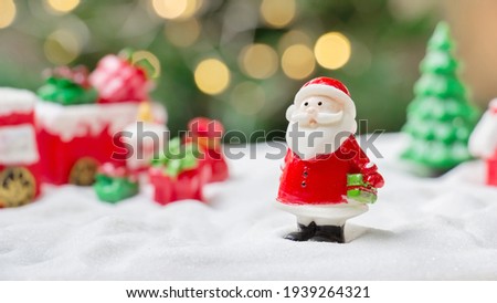 Santa claus doll with shiny light for Christmas decoration background