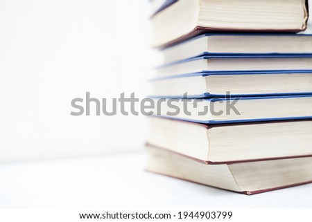 stack of books on white background education and science