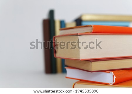 Stack of orange books on white background