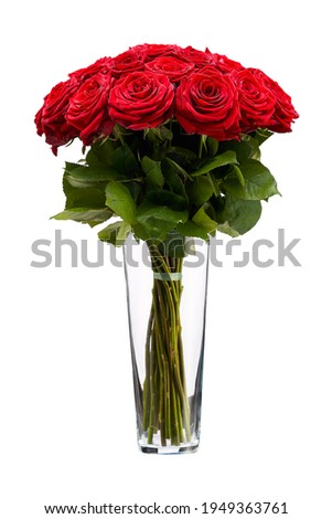 Red roses in a vase isolated.