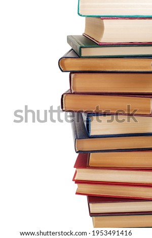 Stack of old books isolated on white background. Vertical photo 