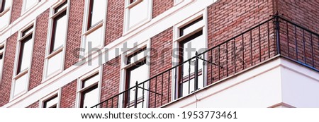 Classic architecture, old building brick facade and windows, architectural detail background.