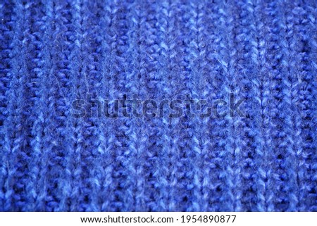 Details of knitted woolen fabric. textile background. Woolen Texture Background, Knitted Wool Fabric, Hairy Fluffy Textile. Closeup