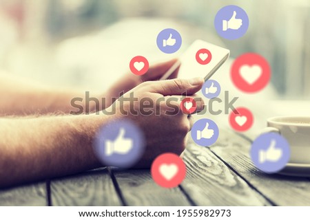 Human hand using smart phone with social media illustration