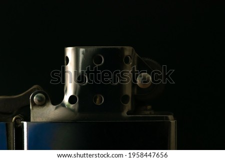Zippo lighter close-up on black background, macro