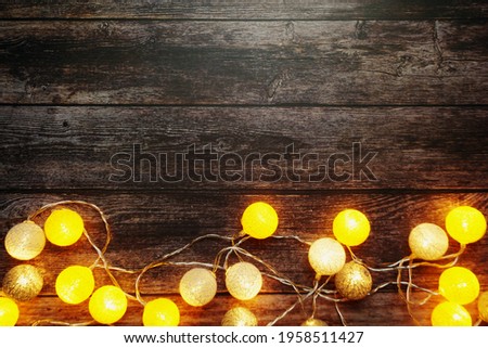 Colorful LED cotton ball decorative on woode background