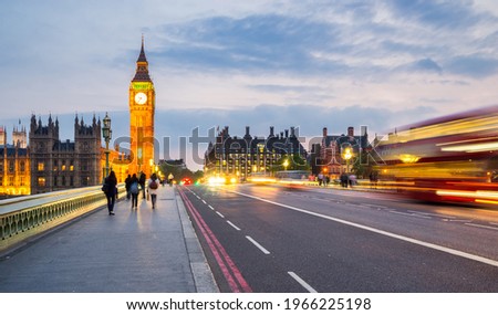 Big Ben clock seen from Westminster bridge at sunset in London. England