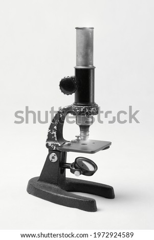 Old microscope for inspection and analysis of defects. Microscope, is an optical device for displaying a small subject at a higher magnification.