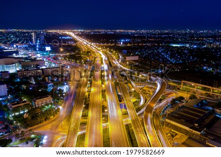 Aerial view of smart transportation with Expressway, Road and Roundabout, multilevel junction traffic highway-Top view. Important infrastructure and transport in big city. For abstract background.