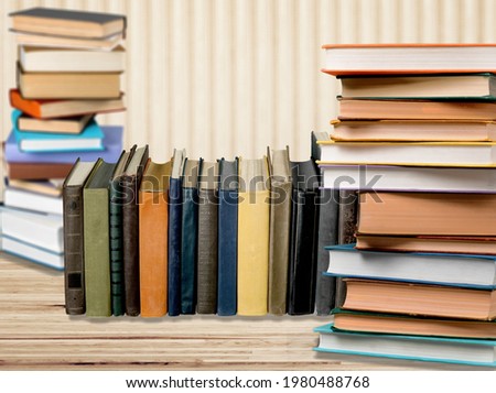 Stack of colored study books on a desk