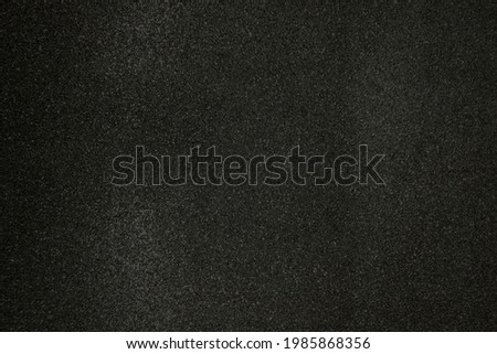 Black shiny glitter background. Dark texture
