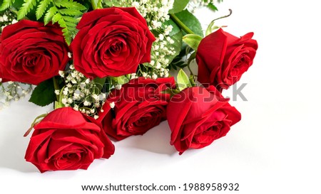 Red roses bouquet on the white background. Nice greeting card for Mothers day, Women day or Valentines day. 