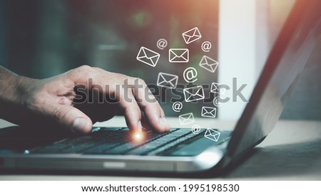 Closeup man hand using Laptop pc with email icon, Email concept