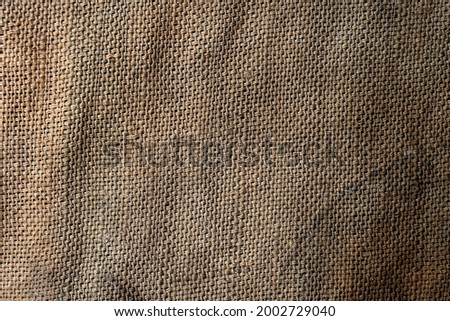 Background and texture of natural brown Sackcloth with Stitches Seam.            