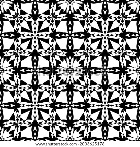 Abstract seamless pattern in black and white.Flat design.Black lace on a white background.Black and white graphics.Art nouveau.For decorating fabric, paper, Wallpaper, and packaging.