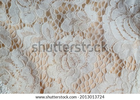 background macro texture of factory fabric with lace pattern