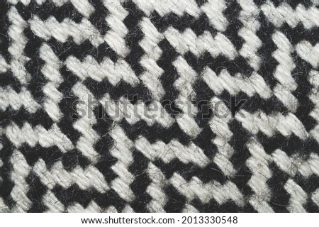 Wool carpet texture close up. knitted rug background