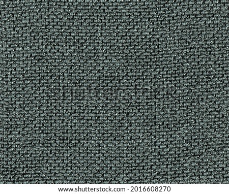 Close-up of the Fabric textile texture, background and wallpaper. The texture of fabric textile upholstery of furniture. High-quality photography.