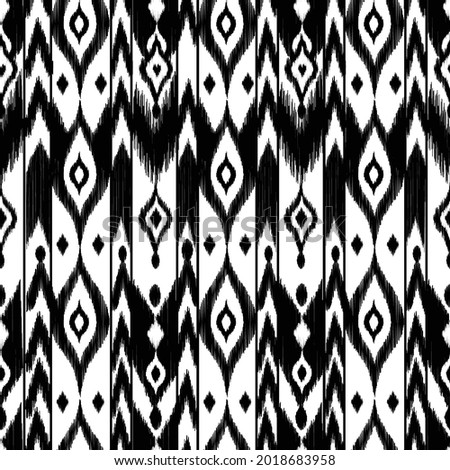 Ikat pattern silk fabric - traditional textile product in Uzbekistan, Cental Asia. Black and white