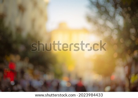 Blur texture background for design. Evening views of buildings and streets of the city of Istanbul. Orange sunset light.