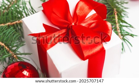 Christmas composition. Gifts, spruce branches, red decorations on a white background. winter, new year concept.