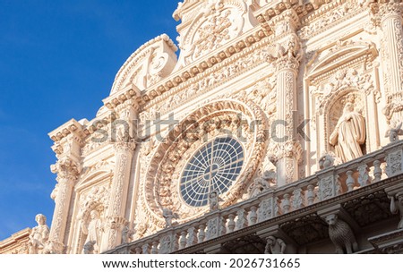 exquisite work in the Baroque style, excellent exteriors of the facades of the Basilica of Santa Croce, emphasis on the rich framing of the stained glass and colonnade
