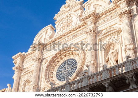 exquisite work in the Baroque style, excellent exteriors of the facades of the Basilica of Santa Croce, emphasis on the rich framing of the stained glass and colonnade