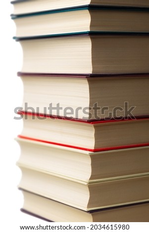 Stack of  books without any names or labels in front of pure white background.