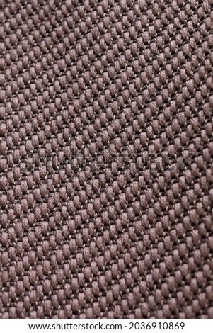 Beige texture background, textile with weaving wicker material. Vertical