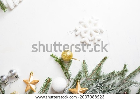Overhead view of Christmas decorations on green branches and decor