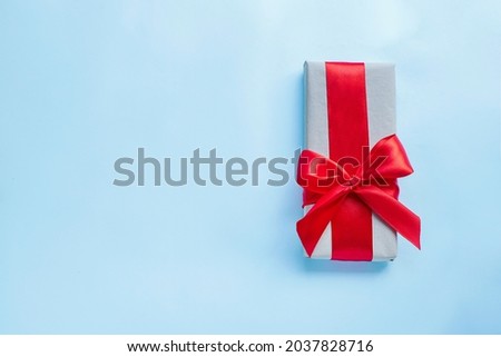 Present box with red bow. Image with copy space