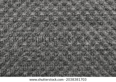 Textile. Material. Gray carpet background. Floor mat texture. Fabric