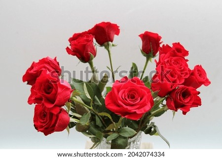 Bouquet of red roses in glass vase