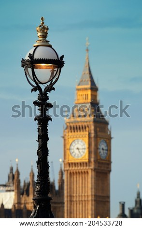 Vintage lamp post on Westminster Bridge with Big Ben in London..