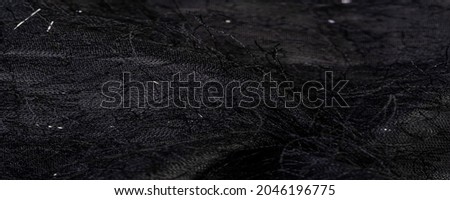 Charcoal black silk fabric with sequins and yarns over the surface of the fabric. This ombre tulle in black with abstract embroidery, embellished with sequins and yarns from a European designer