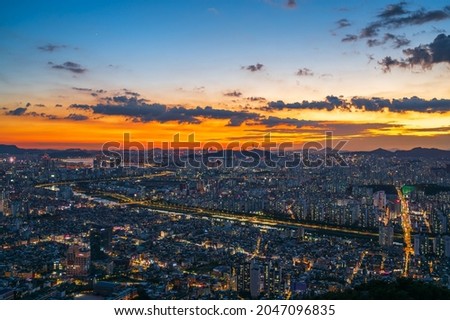 Beautiful sky of Seoul City and skyline with skyscrapers in Sunset, Han river viewpoint from Yongma Mountain or Yongmasan in Seoul,South Korea