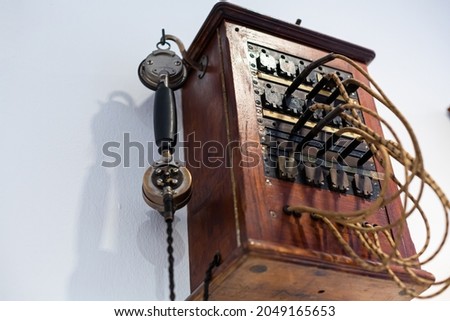 Details of the antique telephone set made of wood.